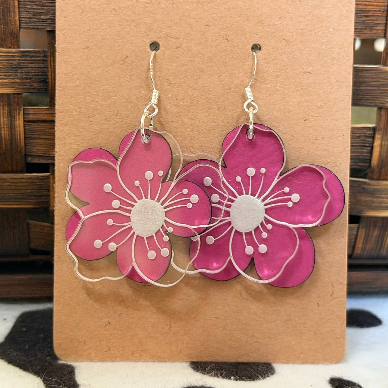 Clear acrylic with layer of pink Leatherette behind